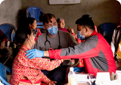 Healthcare volunteers supporting a patient
